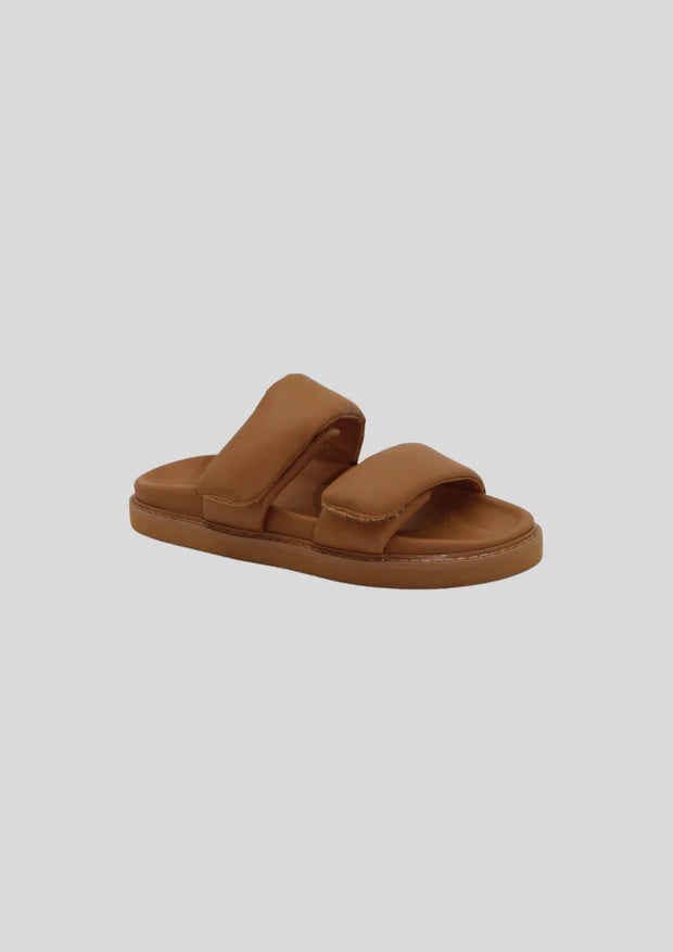 Leather slide with adjusted velcro padded straps and moulded sole  Leather upper  Padded adjustable velcro straps  1.5cm moulded sole with footbed leather lining