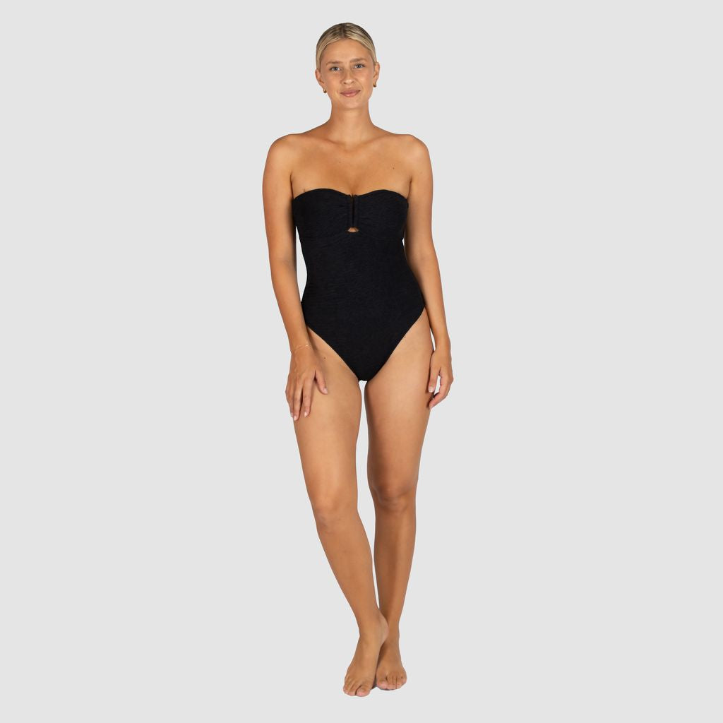 Hidden underwire and boning support for added structure 
Removable and adjustable straps for versatile styling
U-trim detailing at the front
Removable soft cups
Fully lined
Gripper elastic for a secure fit
Crinkle Fabric
Fabric: 93% Polyamide / 7% Elastane
Fabric: Made in Italy
Designed and Made in Australia