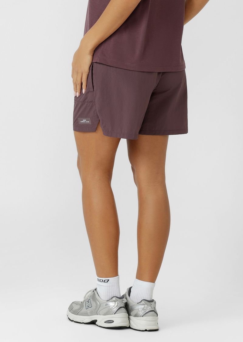 Mid Rise Longer Line Silhouette, 12.5cm Inseam
Water Repellent Taslon Active Fabrication
Notched Side Seams for Unrestricted Movement
Elasticated Waistband with Drawcord Adjustability
3 Pocket Design to Stash your Essentials- 2x Press Stud Side Pockets with Second Zip Pocket Layer