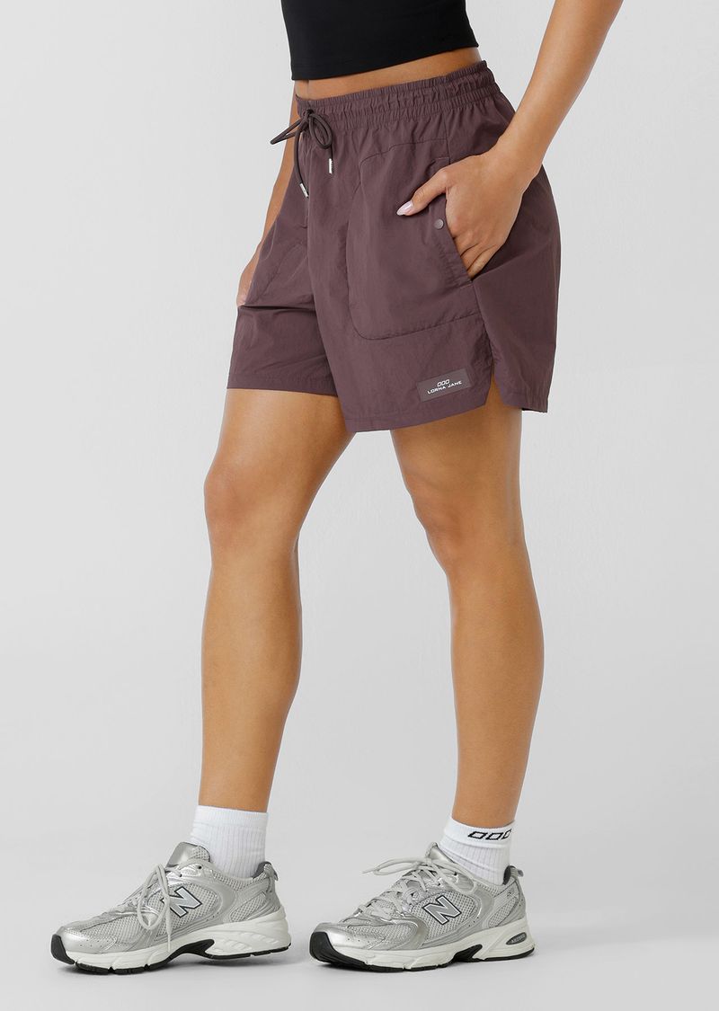 Mid Rise Longer Line Silhouette, 12.5cm Inseam
Water Repellent Taslon Active Fabrication
Notched Side Seams for Unrestricted Movement
Elasticated Waistband with Drawcord Adjustability
3 Pocket Design to Stash your Essentials- 2x Press Stud Side Pockets with Second Zip Pocket Layer