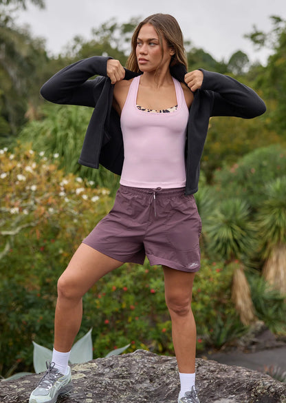 Mid Rise Longer Line Silhouette, 12.5cm Inseam
Water Repellent Taslon Active Fabrication
Notched Side Seams for Unrestricted Movement
Elasticated Waistband with Drawcord Adjustability
3 Pocket Design to Stash your Essentials- 2x Press Stud Side Pockets with Second Zip Pocket Layer