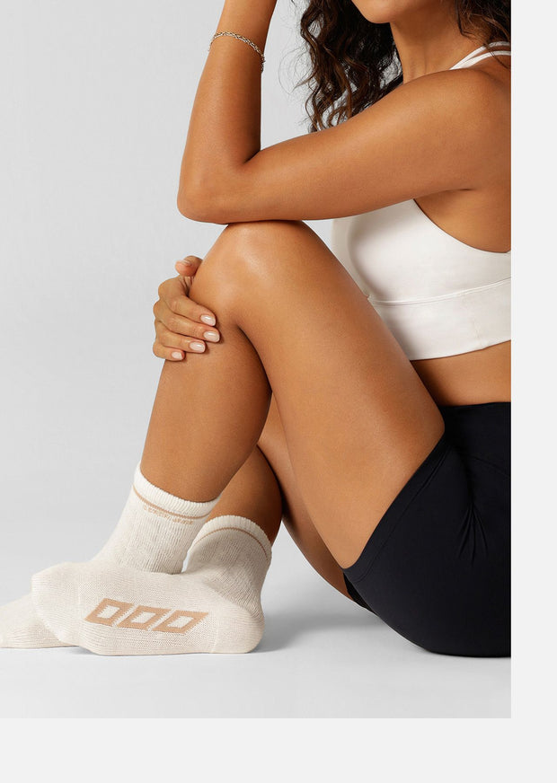 Embrace winter style and comfort in the Cable Knit Crew Socks! Designed to be worn out for the perfect athleisure look, as well as just lounging at home, these crew length socks are crafted from our breathable cotton blend cable knit for all day wear.