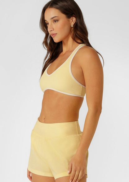 Supportive Racerback Silhouette for All Day Comfort &amp; Support
Designed for Active and Swim, with Quick Dry Padding
Form Flatting V Shaped Neckline with Curved Underbust Band
Sweat Wicking Active Rib Fabrication
Contrast Binding for a Retro-Sport inspired look