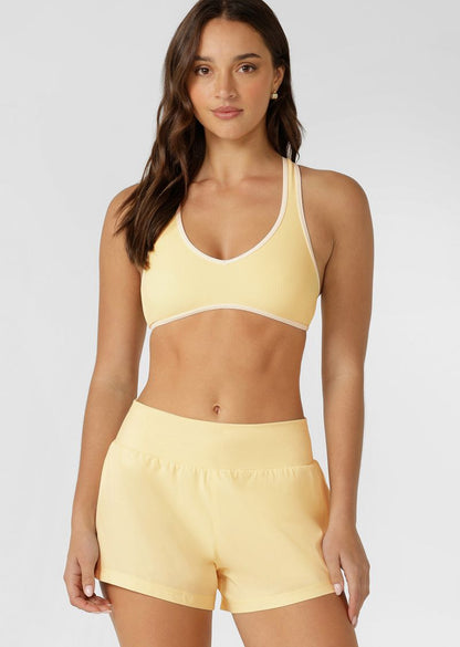 Supportive Racerback Silhouette for All Day Comfort &amp; Support
Designed for Active and Swim, with Quick Dry Padding
Form Flatting V Shaped Neckline with Curved Underbust Band
Sweat Wicking Active Rib Fabrication
Contrast Binding for a Retro-Sport inspired look