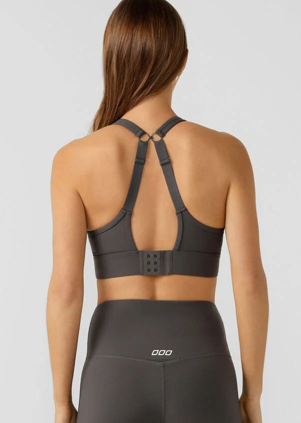Engineered for high-intensity movement, the Compress & Compact Sports Bra provides maximum support without compromising on comfort. Constructed with thicker adjustable straps and wide hems for the ultimate compressive fit. Featuring Bounce Reducing Mesh and Unmatched Coverage so you can be bold with movement, knowing that our Compress & Compact Sports Bra is your no.1 supporter. 