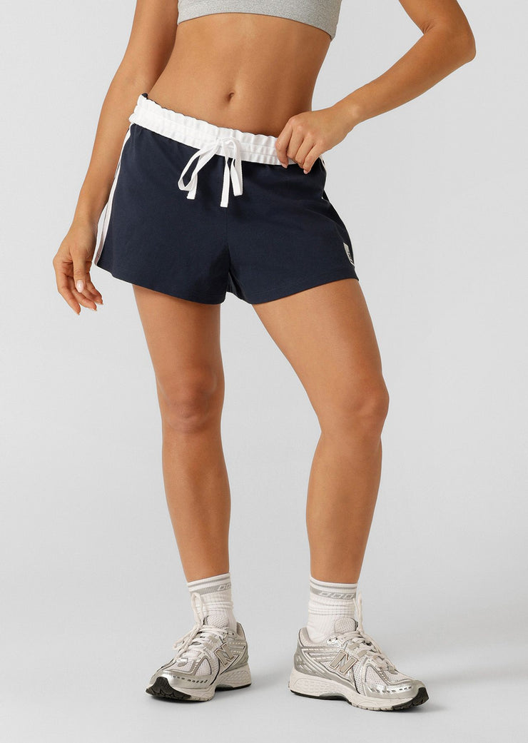 Fan-favourite alert! We're bringing back the beloved Dance Shorts to elevate your athleisure game. Designed for style and comfort, these cotton-jersey shorts feature a fold over waistband with drawcord adjustability, retro-sport inspired contrast striping down the side leg and our limited edition badge. Get it quick, this is a must-have style for summer!