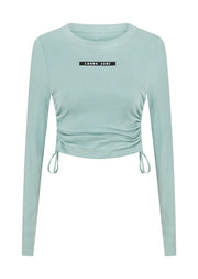Discover the perfect blend of style and comfort with this long sleeve top, your new must have wardrobe essential. Crafted from a soft and breathable viscose blend rib fabrication, the adjustable drawcord sides allow you to customise your look, making it perfect for wearing back with your active as well as everyday looks. With thumbholes to secure your sleeves while training, this really is the perfect winter base layer.