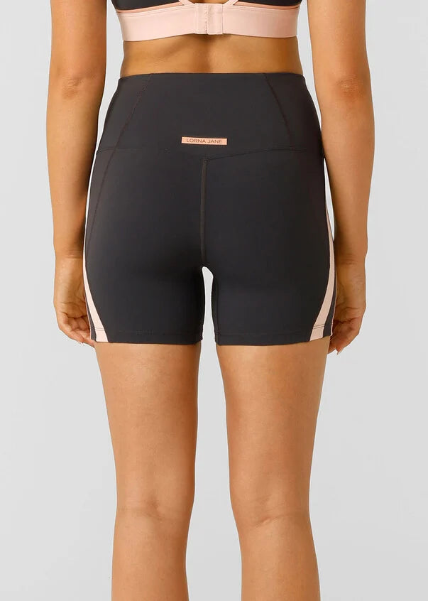 Embrace your pace with these supportive 12cm bike shorts. Made from our iconic Bare Minimum fabric for the ultimate weightless feeling, these shorts feature drawcord adjustability to keep your waistband in place, sporty contrast panelling that contours your curves and a secret no bounce back pocket to stash your essentials. These shorts have you covered no matter the workout.
