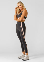 Embrace your pace with these supportive ankle biter leggings. Made from our iconic Bare Minimum fabric for the ultimate weightless feeling, these leggings feature drawcord adjustability to keep your waistband in place, sporty contrast panelling that contours your curves and a secret back pocket to stash your essentials. These leggings have you covered no matter the workout.