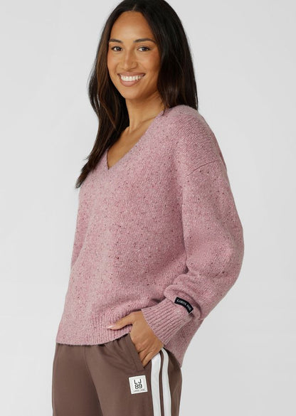 Flattering Relaxed Fit V-Neck Silhouette
Premium True Knit Wool Blend Fabrication in an Elevated Marl Look
Classic Ribbed Cuffs and Hemline