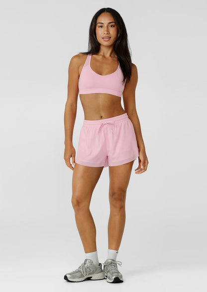 Crafted in sweat wicking Nothing 2 See Here™ fabric, it features a compressive underbust band for high support and a racerback silhouette that clears the shoulder blades for unrestricted movement. Mesh panelling enhances airflow, while the form flattering V shaped neckline balances strength with style.