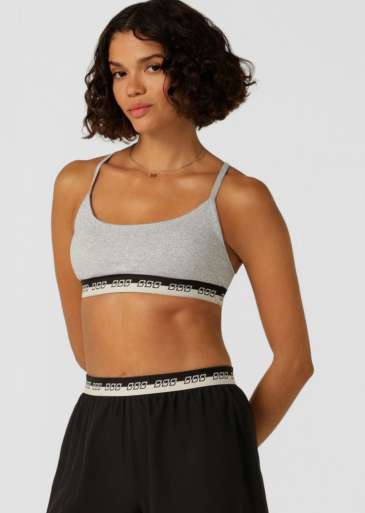 Make a statement in the iconic all day sports bra. Made from our soft & supple True Comfort fabric, this style features limited edition iconic elastic across the hem, adjustable shoulder straps and removable padding for shape and support.