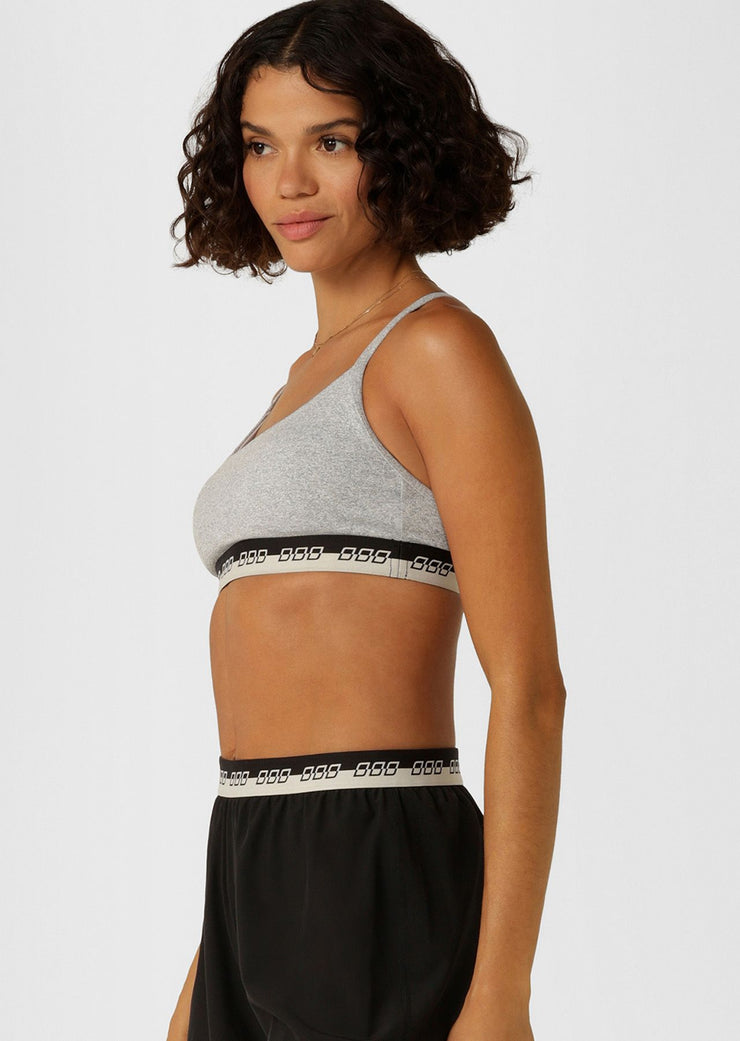 Make a statement in the iconic all day sports bra. Made from our soft & supple True Comfort fabric, this style features limited edition iconic elastic across the hem, adjustable shoulder straps and removable padding for shape and support.