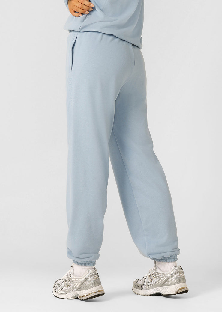 Layer up in this iconic track pant, made from soft and breathable cotton terry with our limited edition embroidered logo. In an effortless relaxed fit with drawcord adjustability, tapered ankles and side pockets, this track pant is the perfect winter essential.
