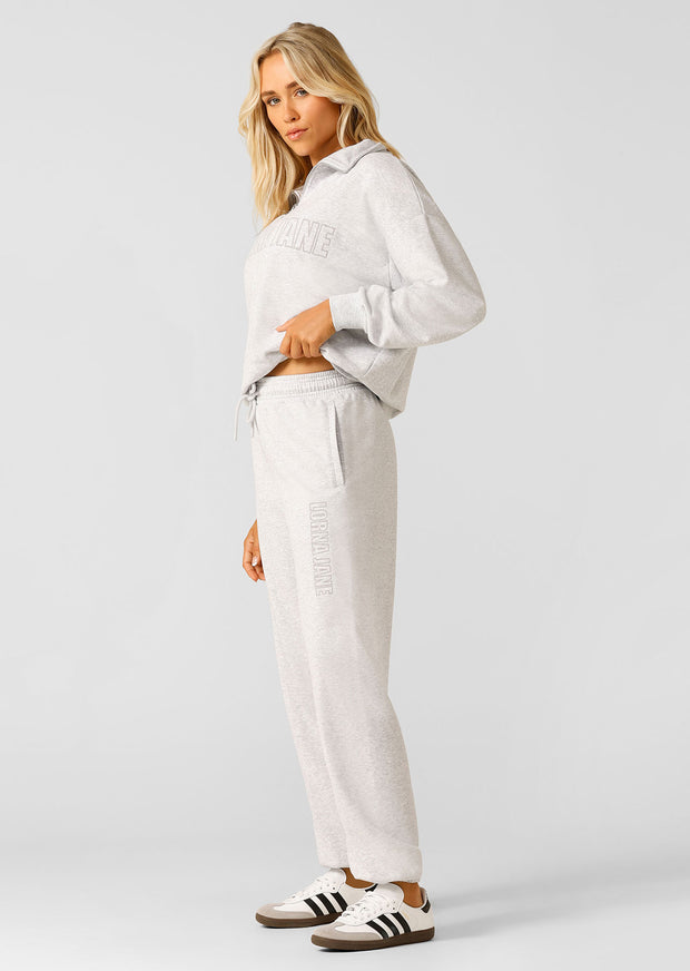 Layer up in this iconic track pant, made from soft and breathable cotton terry with our limited edition embroidered logo. In an effortless relaxed fit with drawcord adjustability, tapered ankles and side pockets, this track pant is the perfect winter essential.