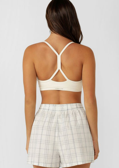 Y-shape Racerback Silhouette  Clears the Shoulder Blades & Provides All Day Support
Form Flattering V-shaped neckline and underbust panel 
Hidden Bounce Resistant Lining for Added Support
Keyhole Back Design for Added Ventilation
LJ Rubber Logo Badge 