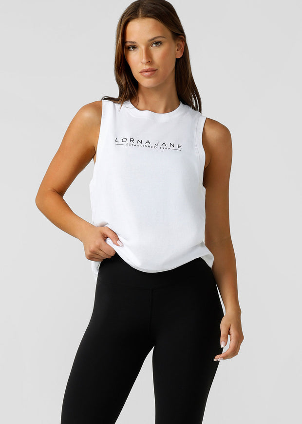 Crafted from breathable cotton jersey with LJ limited edition minimalist logo print, the Kickstart Muscle Tank will be your go-to top in and-out of the gym. Pair it with the Lotus Flared Leggings for a stylish 'fit, or wear it over your favourite LJ set to hit the gym.