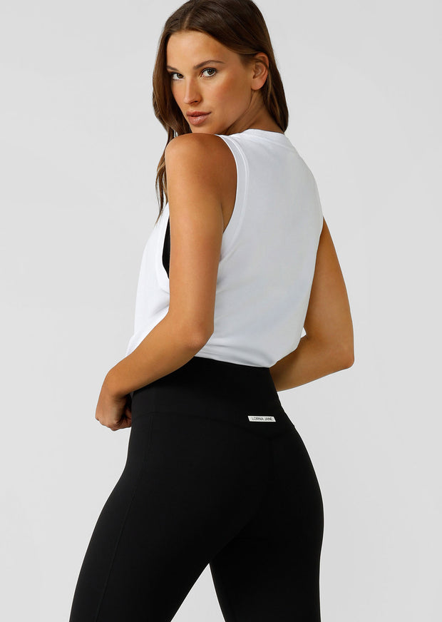 Crafted from breathable cotton jersey with LJ limited edition minimalist logo print, the Kickstart Muscle Tank will be your go-to top in and-out of the gym. Pair it with the Lotus Flared Leggings for a stylish 'fit, or wear it over your favourite LJ set to hit the gym.