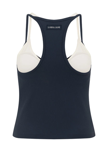 Built In Shelf Bra with Removable Padding for All Day Support
Fashion Forward Layered Look Design
Form Flattering Full Length Fitted Silhouette
Sweat wicking Luxe Active Rib Fabrication
Woven Logo Badge