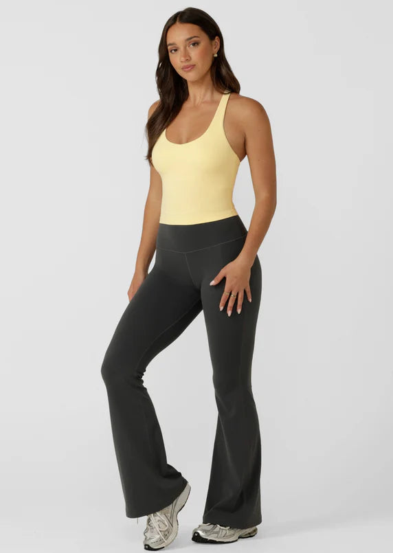 Built in Shelf Bra with Removable Padding for All Day Support
Form Flattering Cropped Fitted Silhouette
Supportive Racerback Silhouette Clears the Shoulder Blades