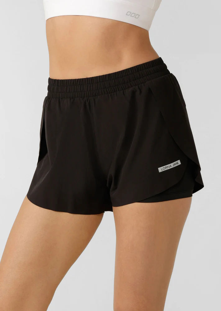 Lightweight Sweat Wicking Shorts Fabrication
Anti-Chafe Compressive and Supportive Internal Shorts Lining
Side Phone Pocket in Internal Shorts Avoids Bounce
Light As Air Bonded Hem Finish and Side Splits for Unrestricted Movement
Reflective Icons Logo + Reflective LJ Rubber Badge
Relaxed Fit
Mid to High Rise