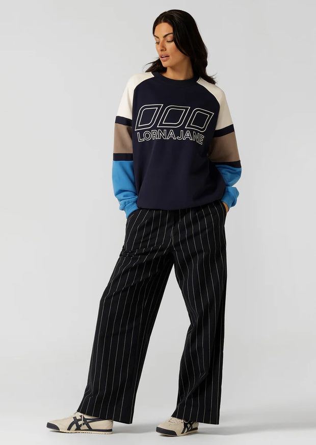 Layer up in this effortlessly cool sweatshirt. Made from our super soft and breathable cotton terry, it's the perfect transitional style you can wear throughout and after winter. Complete with our iconic colour blocking and statement logo embroidery, this is your must-have athleisure styling piece