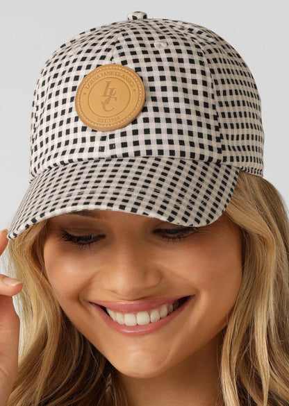 
Must-Have Styling Essential
Limited Edition All Over Blue Check Print
Curved Brim
Adjustable Band
Premium Patch Logo