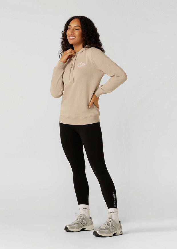 Introducing the Lotus Hoodie - your essential trans-seasonal layering piece! This lightweight relaxed fit jumper is complete with our elevated heritage embroidered logo, a functional drawcord hood and classic ribbed cuffs and hem band.