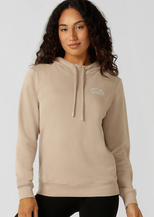 Introducing the Lotus Hoodie - your essential trans-seasonal layering piece! This lightweight relaxed fit jumper is complete with our elevated heritage embroidered logo, a functional drawcord hood and classic ribbed cuffs and hem band.