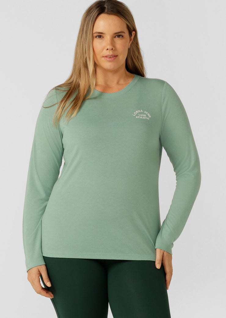 An easy layering piece for cooler weather, the Lotus Long Sleeve Top. This relaxed fit layering piece is made from lightweight and breathable LJ Active fabric, so it stretches with you in and out of the gym