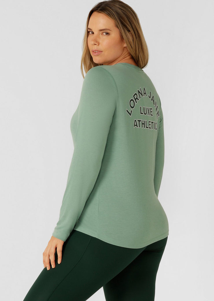 An easy layering piece for cooler weather, the Lotus Long Sleeve Top. This relaxed fit layering piece is made from lightweight and breathable LJ Active fabric, so it stretches with you in and out of the gym