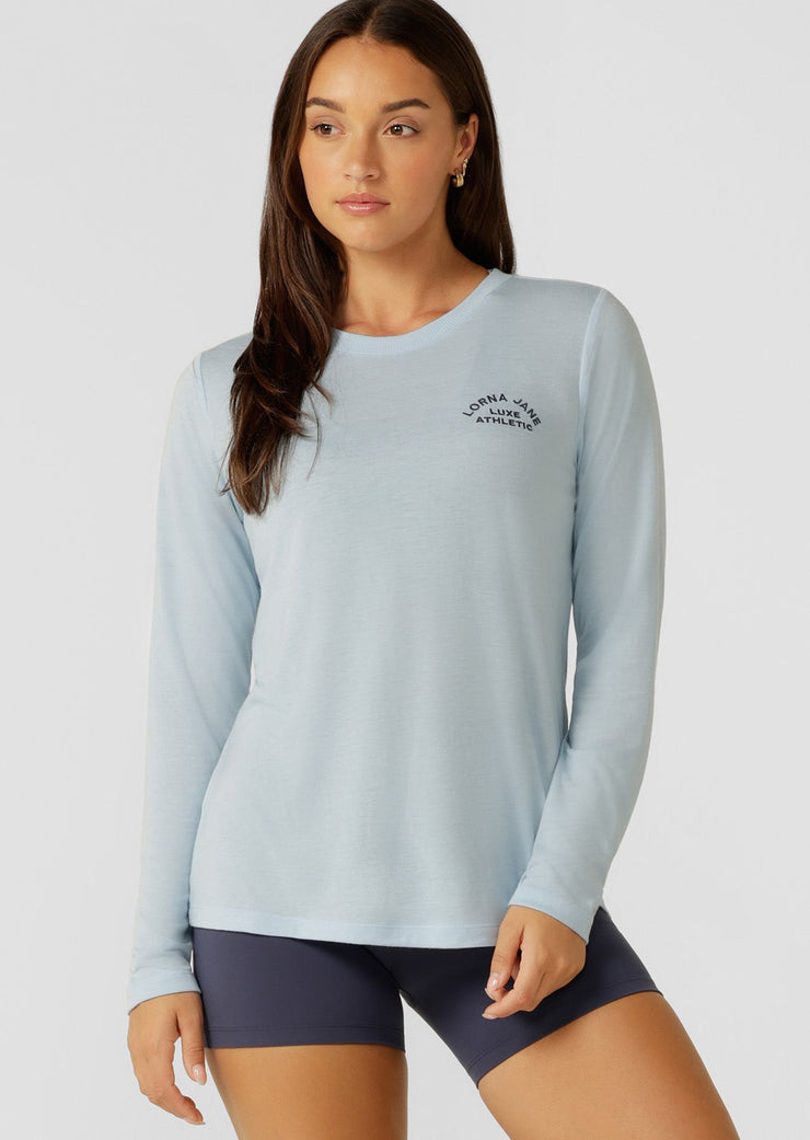 An easy layering piece for cooler weather, the Lotus Long Sleeve Top. This relaxed fit layering piece is made from lightweight and breathable LJ Active fabric, so it stretches with you in and out of the gym.