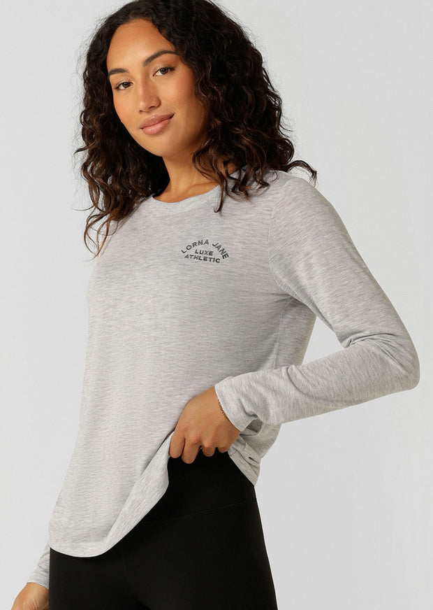 An easy layering piece for cooler weather, the Lotus Long Sleeve Top. This classic fit layering piece is made from lightweight and breathable LJ Active fabric, so it stretches with you in and out of the gym. The versatile design is perfect to layer over your favourite LJ sports bra and leggings or wear back with denim for your off-duty weekend look.