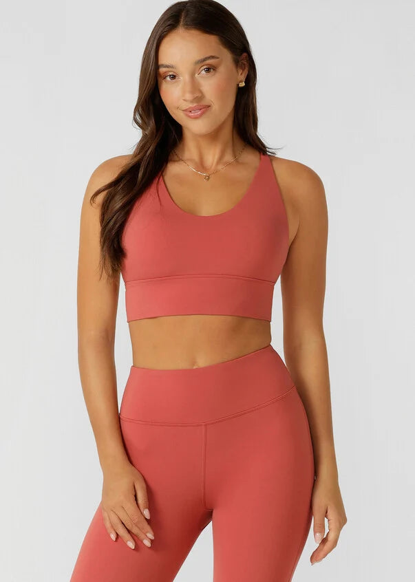 Meet your go-to all day support sports bra! The Lotus Longline Sports Bra by Lorna Jane will take you from weekday to weekend with its versatile design and smoothing all-day support. Made from our soft and stretchy Nothing 2 See Here™ Fabric, you'll feel confident through every twist and bend. The Lotus Sports Bra is a cut above the rest with its flattering V-neckline and too cute to cover strappy back detailing, making it perfect for everything from yoga to coffee dates. Pair this with the Lotus leggings o