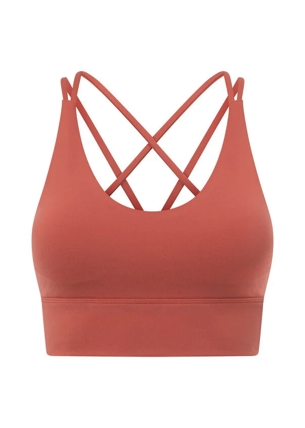 Meet your go-to all day support sports bra! The Lotus Longline Sports Bra by Lorna Jane will take you from weekday to weekend with its versatile design and smoothing all-day support. Made from our soft and stretchy Nothing 2 See Here™ Fabric, you'll feel confident through every twist and bend. The Lotus Sports Bra is a cut above the rest with its flattering V-neckline and too cute to cover strappy back detailing, making it perfect for everything from yoga to coffee dates. Pair this with the Lotus leggings o