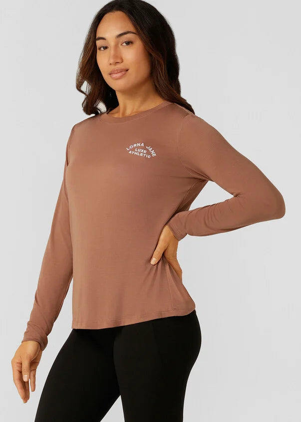 An easy layering piece for cooler weather, the Lotus Long Sleeve Top. This classic fit layering piece is made from lightweight and breathable LJ Active fabric, so it stretches with you in and out of the gym.