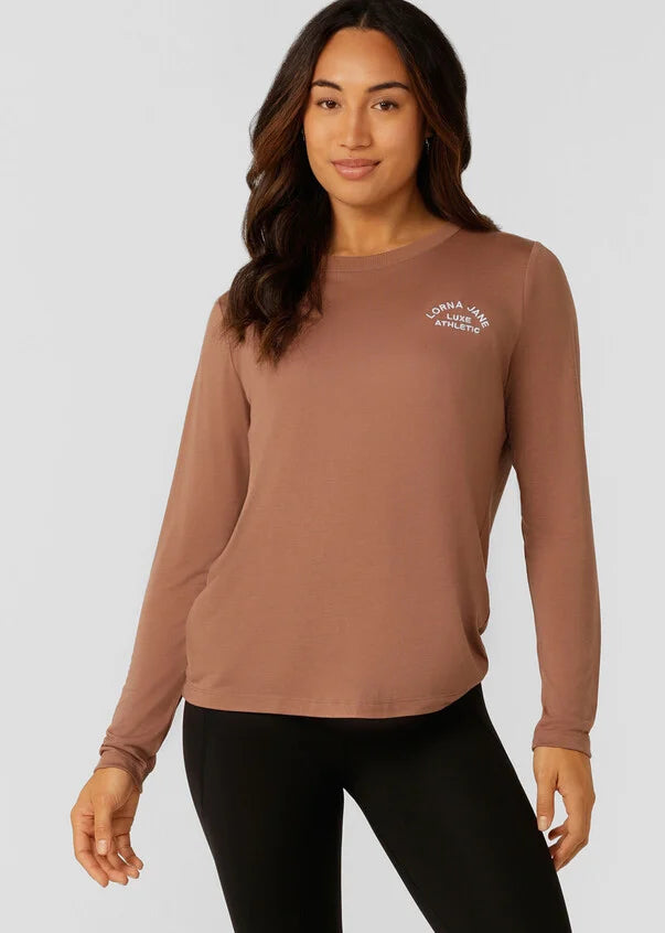 An easy layering piece for cooler weather, the Lotus Long Sleeve Top. This classic fit layering piece is made from lightweight and breathable LJ Active fabric, so it stretches with you in and out of the gym.