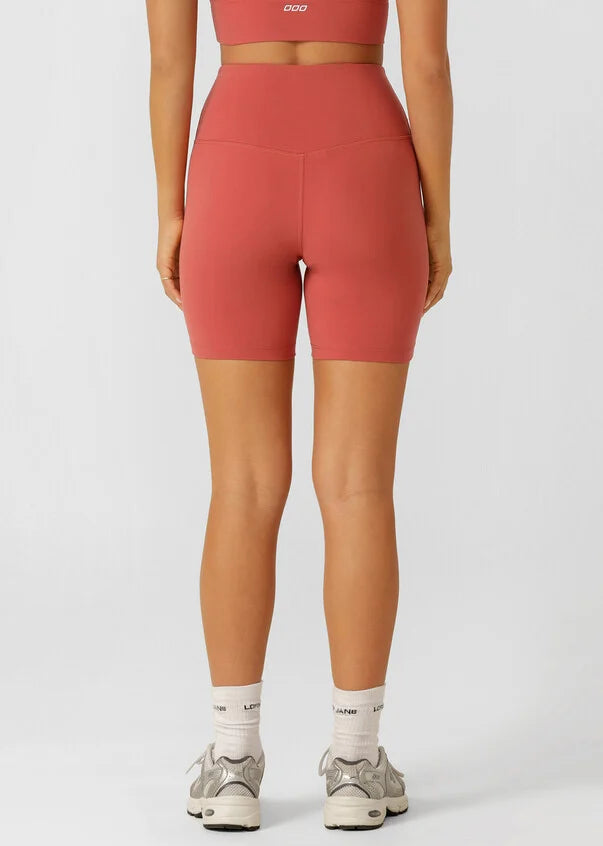 The Lotus 12cm Bike Short is designed for the 'IT' girl on the go. Simple, versatile and oh-so fashionable, these shorts are Lightly Brushed Soft Feel and thoughtfully designed for lounging, yoga, beach walks or coffee dates. They are constructed with a hidden back pocket and no internal leg seam for ultimate no chafe comfort