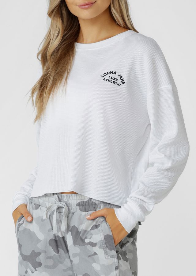Versatile, Transseasonal Wardrobe Essential
Premium Cotton Blend Waffle Fabrication in our Statement Soft Camo Print
Classic Ribbed Crew Neckline and Sleeve Cuffs
Effortless Slightly Cropped Relaxed Fit Silhouette
Classic Lotus Logo Embroidery