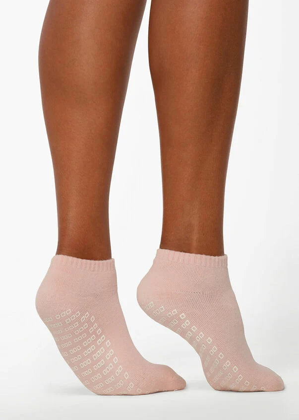 Introducing the perfect accessory for your pilates practice - Merino Wool Blend Icon Pilates Socks! Made from a high-quality, soft and breathable merino wool-blend, these socks will keep your feet warm during your practice, while also featuring grip sole technology so you won't slip on the mat and reformer. These socks are a must-have for any pilates enthusiast looking to elevate their practice.
