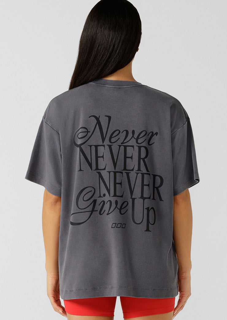 Level up your athleisure looks with the Never Give Up Washed Boyfriend T-shirt. Made from our premium soft cotton fabric, this tee features a limited edition front and back logo print and a one-of-a-kind wash, which is unique to every piece and gives just the right amount of vintage appeal, making it the perfect addition to your active and leisure wardrobe.