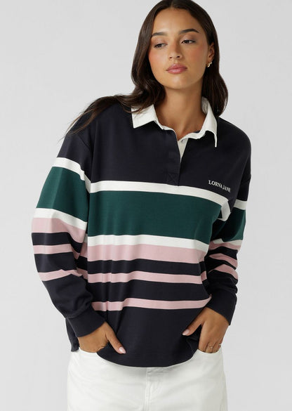 Relaxed Fit
Elevated Yarn Dye Striped Design in a Soft Touch Cotton Fabrication
Rugby Jersey Inspired Design with Contrast Collar and Concealed Button Through Placket
Logo Embroidery