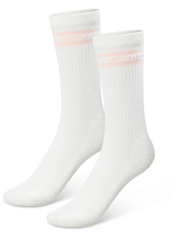 Designed for style and stability during Pilates, barre and yoga workouts, these crew non-slip grip socks are made from our premium, breathable cotton blend yarn, and feature our exclusive grip design on the footbed, with our sporty striped logo design at the ankle. Your new must-have for studio workouts!