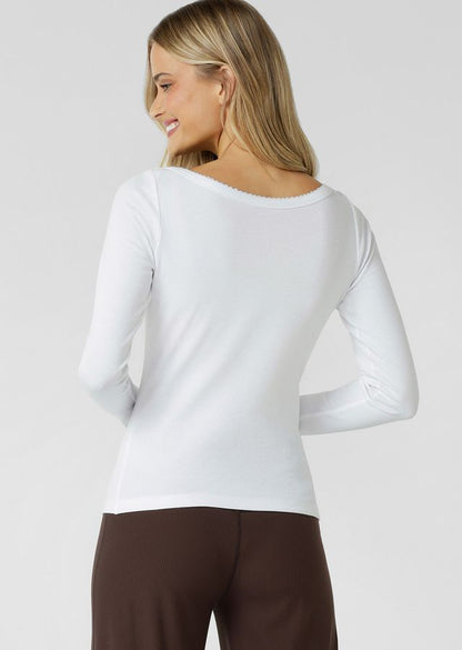 Wear Anywhere Classic Design
Flattering Slim Fit Full Length Silhouette
Wear it your Way Reversible Design- Woven Logo Badge at Front or Back
Fun and Femme Lace Lined Boat Neckline
Soft Cotton Blend Rib You'll Want To Wear All Day, Everyday