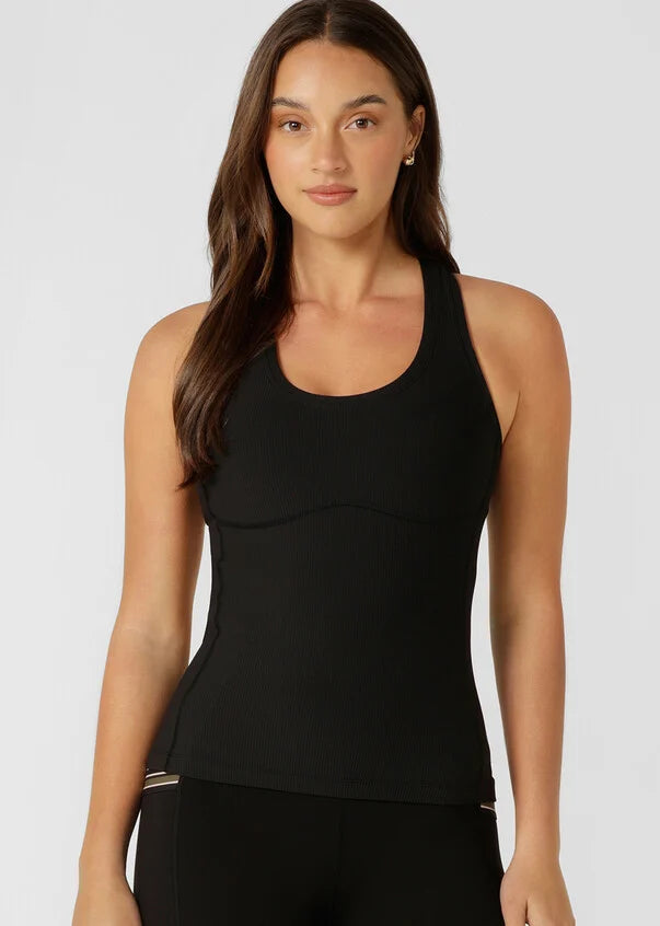 Reach new heights in this active tank designed for high intensity workouts, weekend walks, and everything in between. Designed to become your new active layering essential, the form fitting silhouette stays in place while the active rib fabrication wicks away sweat, so you can focus on your workout