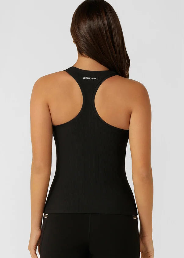 Reach new heights in this active tank designed for high intensity workouts, weekend walks, and everything in between. Designed to become your new active layering essential, the form fitting silhouette stays in place while the active rib fabrication wicks away sweat, so you can focus on your workout