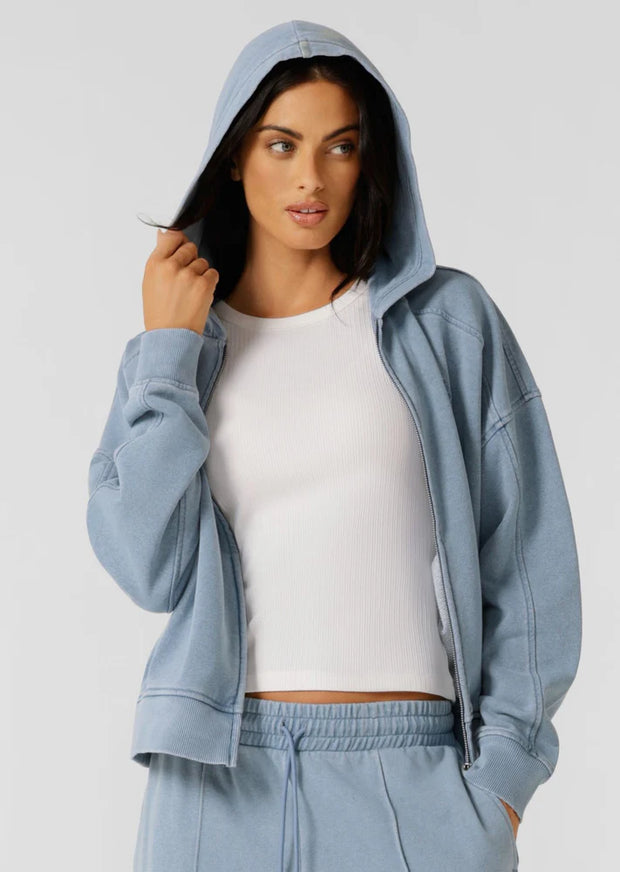 Level up your athleisure look with this vintage-inspired washed zip through hoodie. Made from our transseasonal cotton blend terry fabric, with a cosy hood, this style is designed to keep you warm without compromising on style. Complete with hand pockets to stash your essentials and a one-of-a-kind garment wash, which is unique to every piece and gives just the right amount of vintage appeal. Style back with the Movement Washed Pants for the ultimate retro athleisure look.