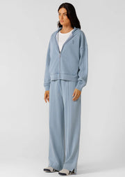Level up your athleisure look with this vintage-inspired washed zip through hoodie. Made from our transseasonal cotton blend terry fabric, with a cosy hood, this style is designed to keep you warm without compromising on style. Complete with hand pockets to stash your essentials and a one-of-a-kind garment wash, which is unique to every piece and gives just the right amount of vintage appeal. Style back with the Movement Washed Pants for the ultimate retro athleisure look.