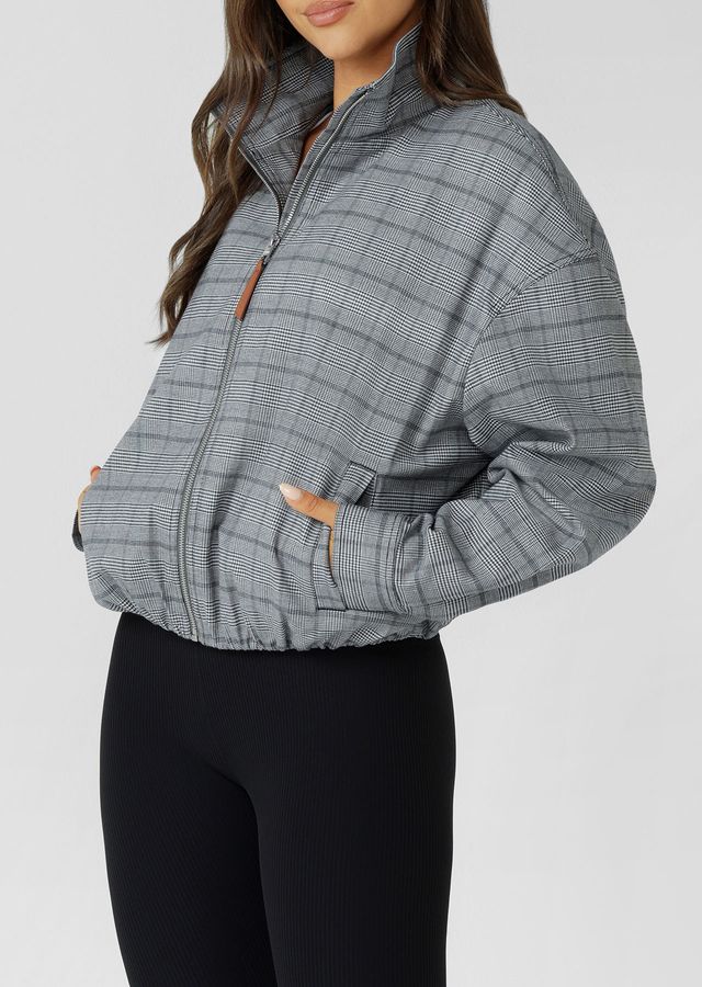 Neat Fit Bomber Inspired Silhouette with High Athletic Neckline and Zip Front Closure
Soft Touch Cotton Blend Fabrication in a classic Grey Mini Check Design
Side Pockets to Stash your Essentials
Adjustable Sleeve Cuffs with Press Stud Closure to Trap in Warmth
Premium Faux Leather Logo Patch and Iconic Zip Puller