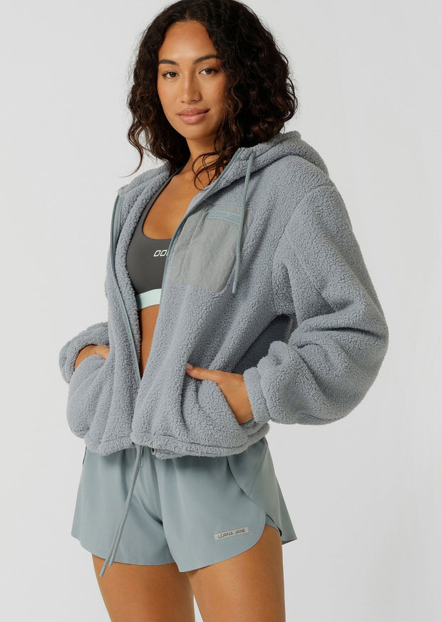 Make a statement in this stylish teddy zip through hoodie, the must-have addition to your athleisure wardrobe. Designed to keep you cosy, this hoodie features drawcord adjustability to trap in the warmth, a no-fuss zip-through opening, oversized silhouette and a multi pocket design, perfect for when the weather starts to cool down.